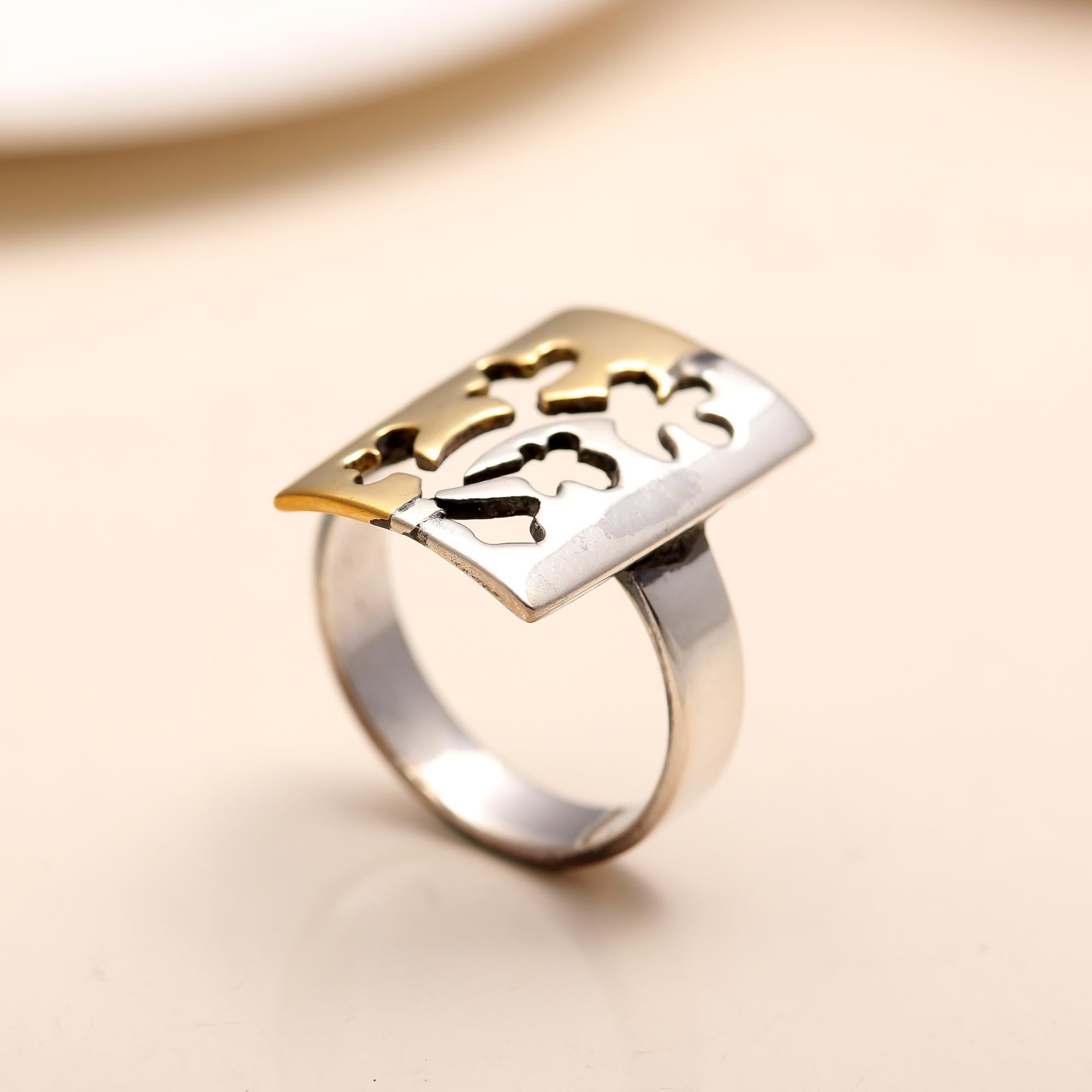 Sterling silver ring with floral cutout and dual-tone finish