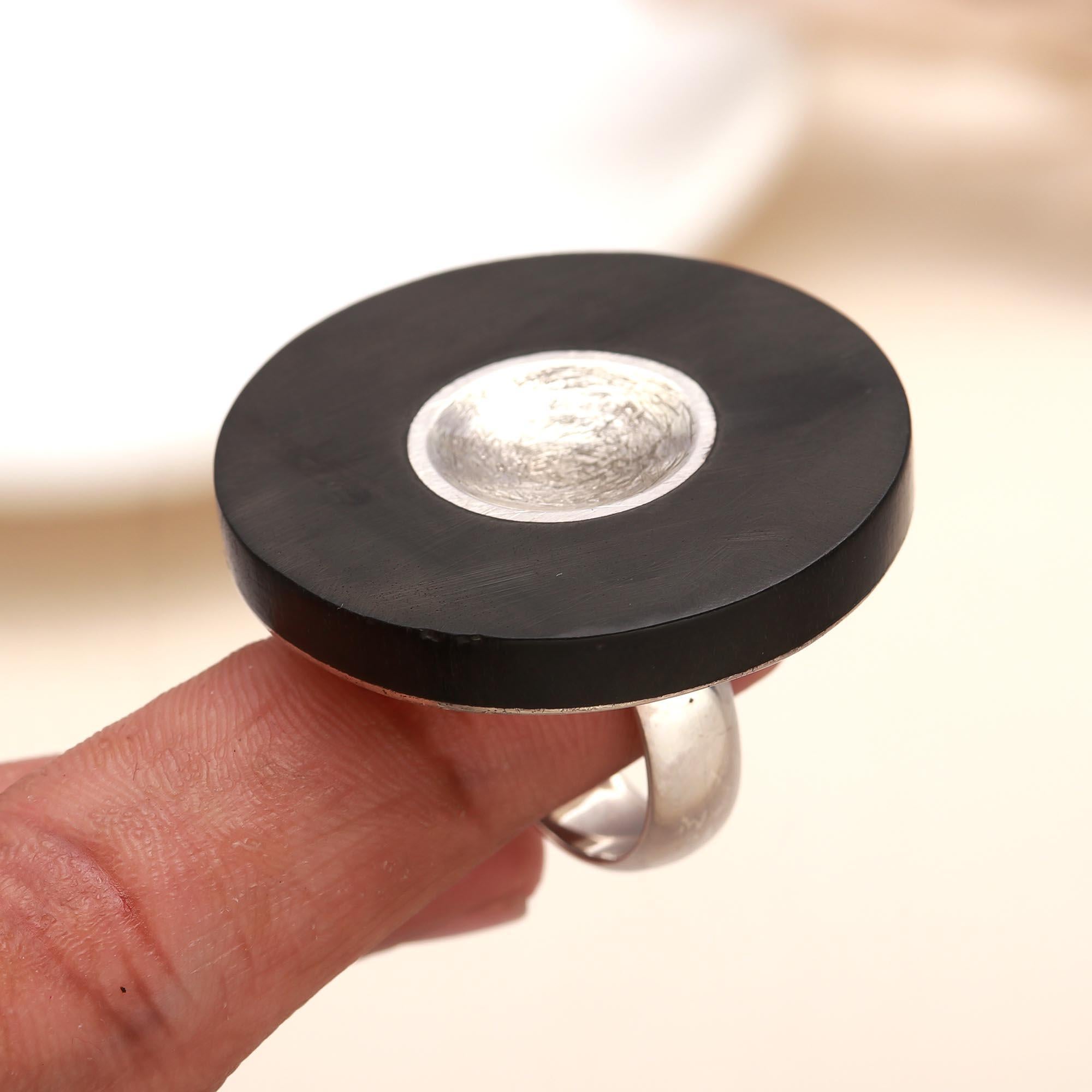 Modern black disc ring set in sterling silver