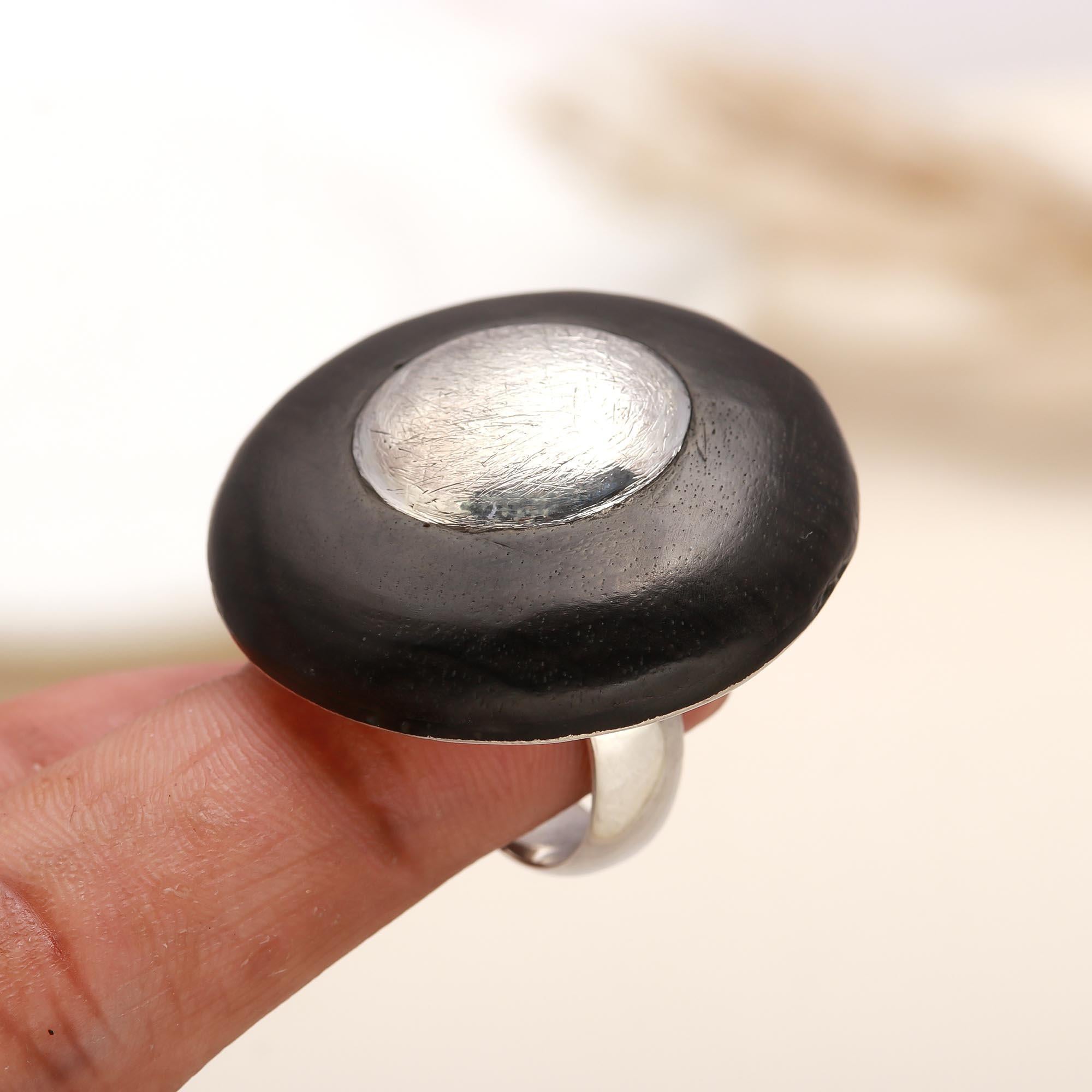 Bold silver center black dome band ring