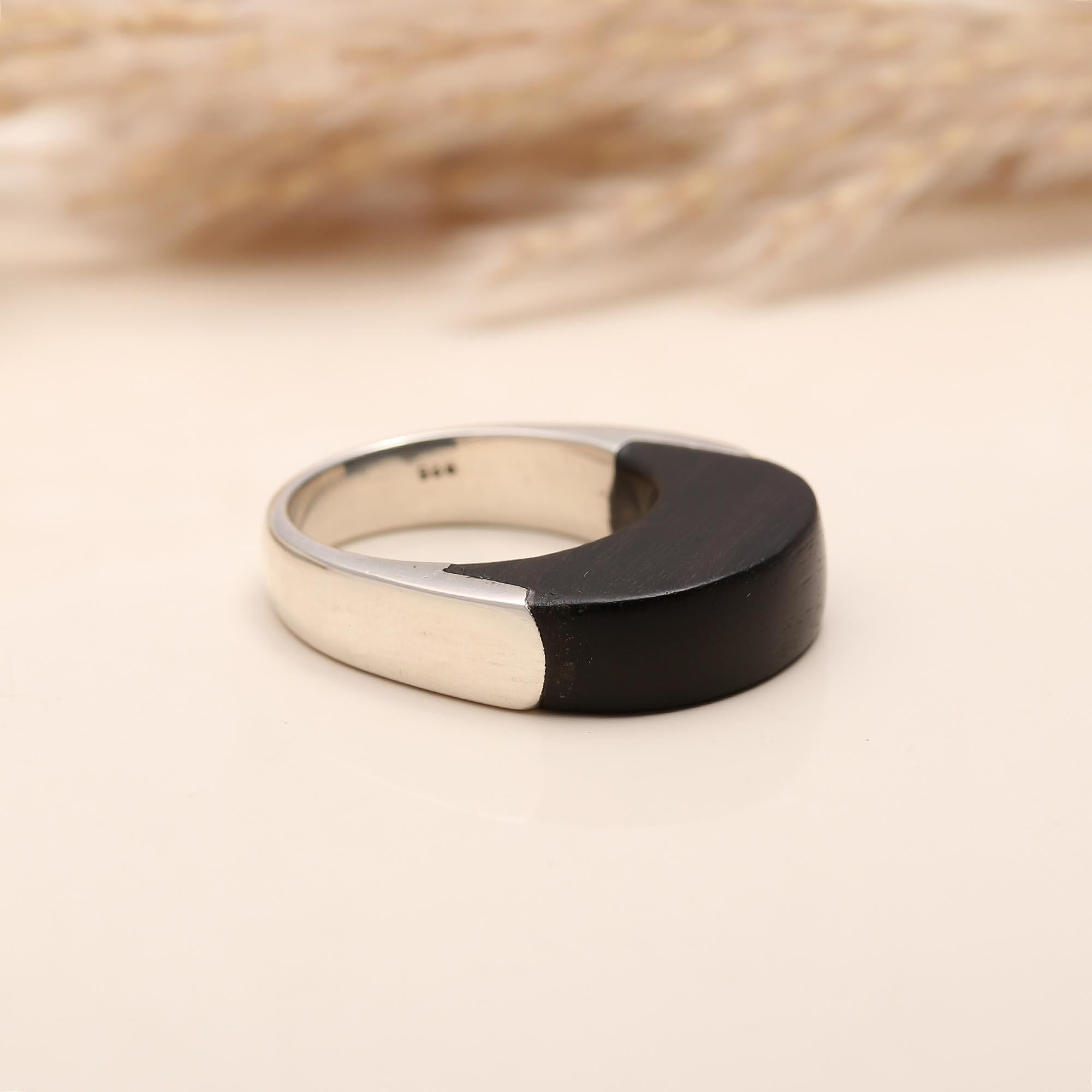 Half dome black enamel-style silver ring close-up