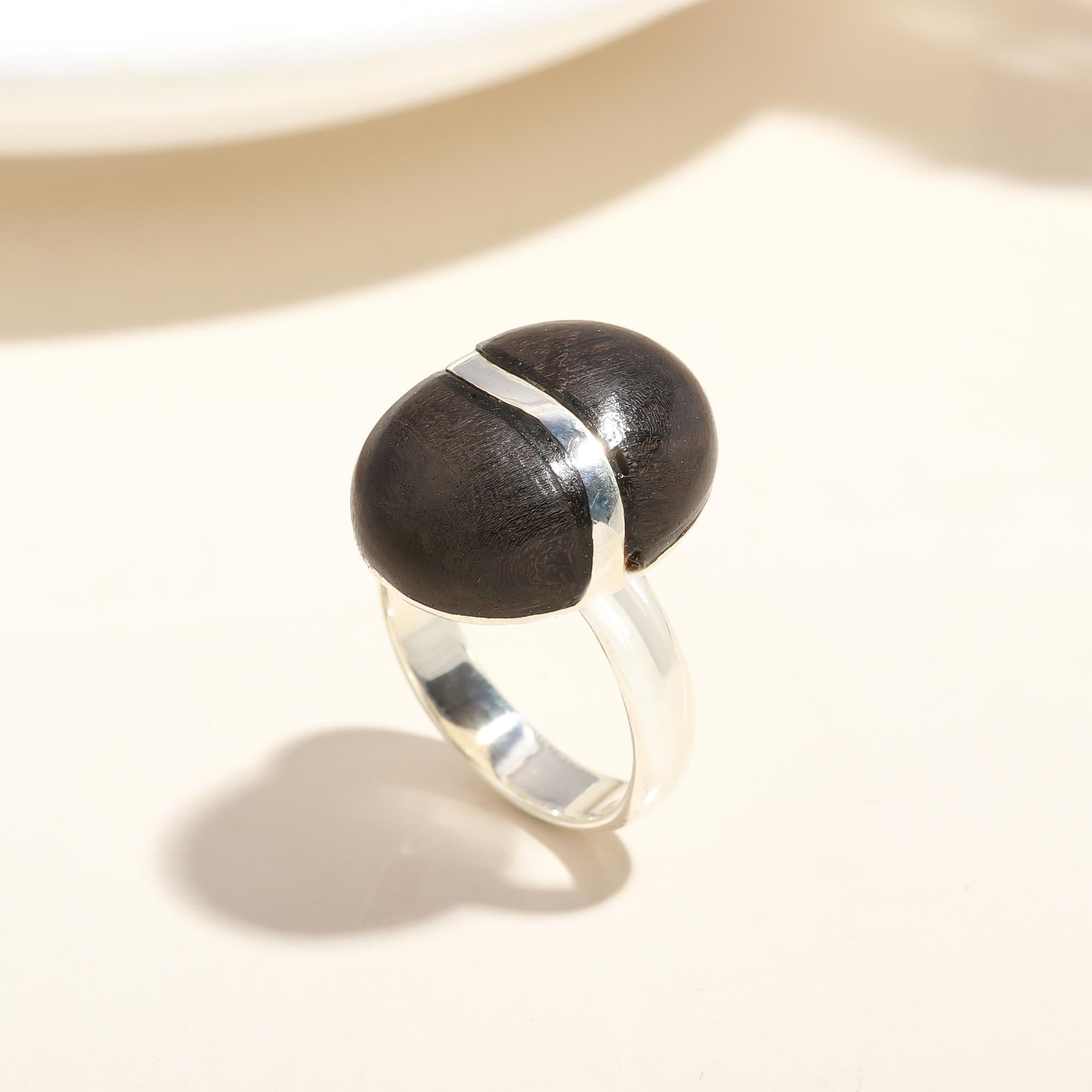 Handmade sterling silver ring with ebony wood centerpiece