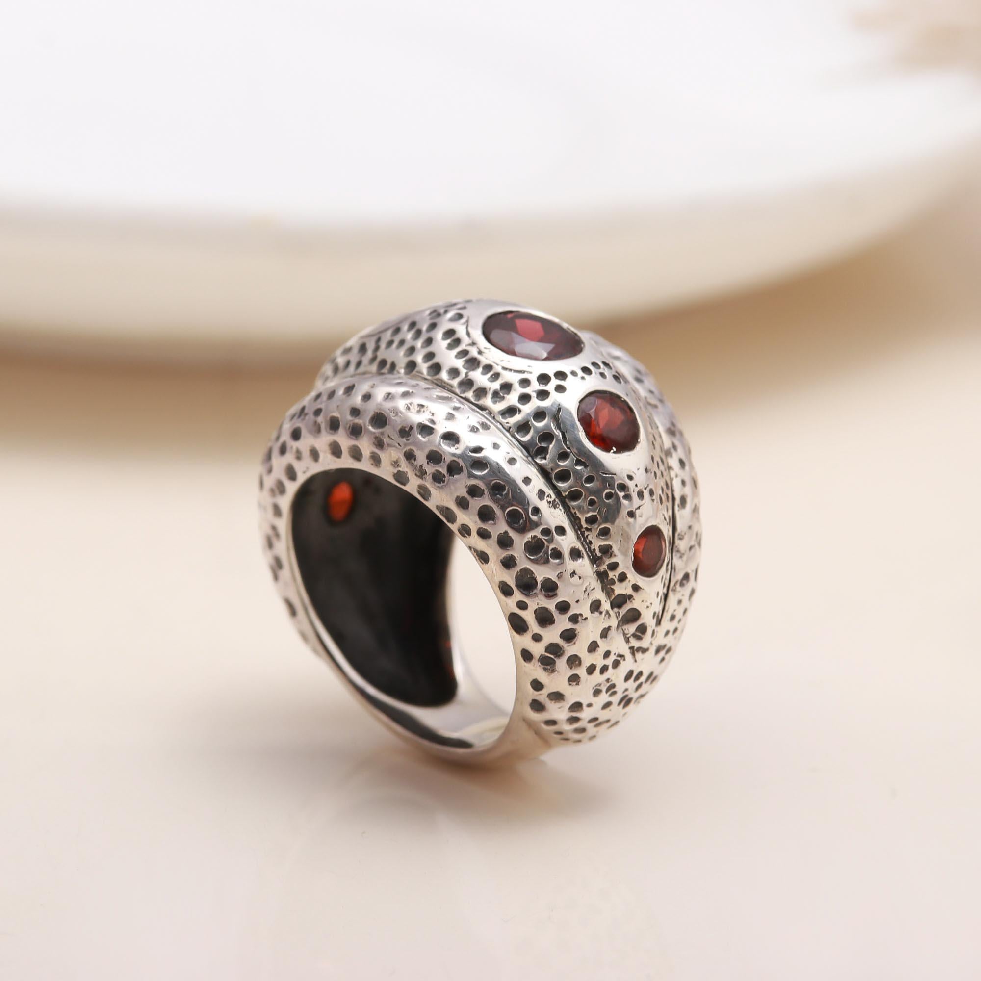 Handmade sterling silver band ring with garnet stones