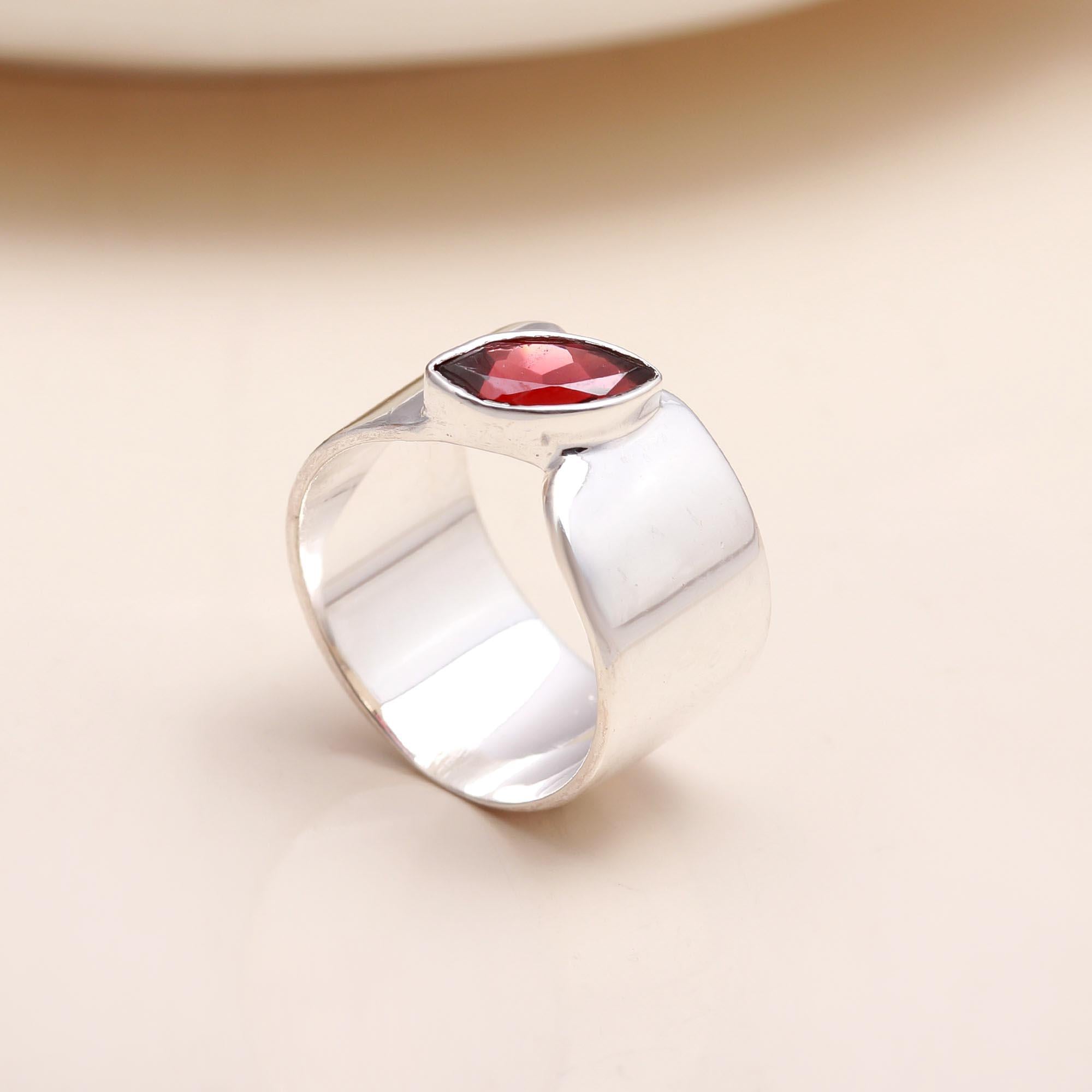 Handmade sterling silver open band garnet ring