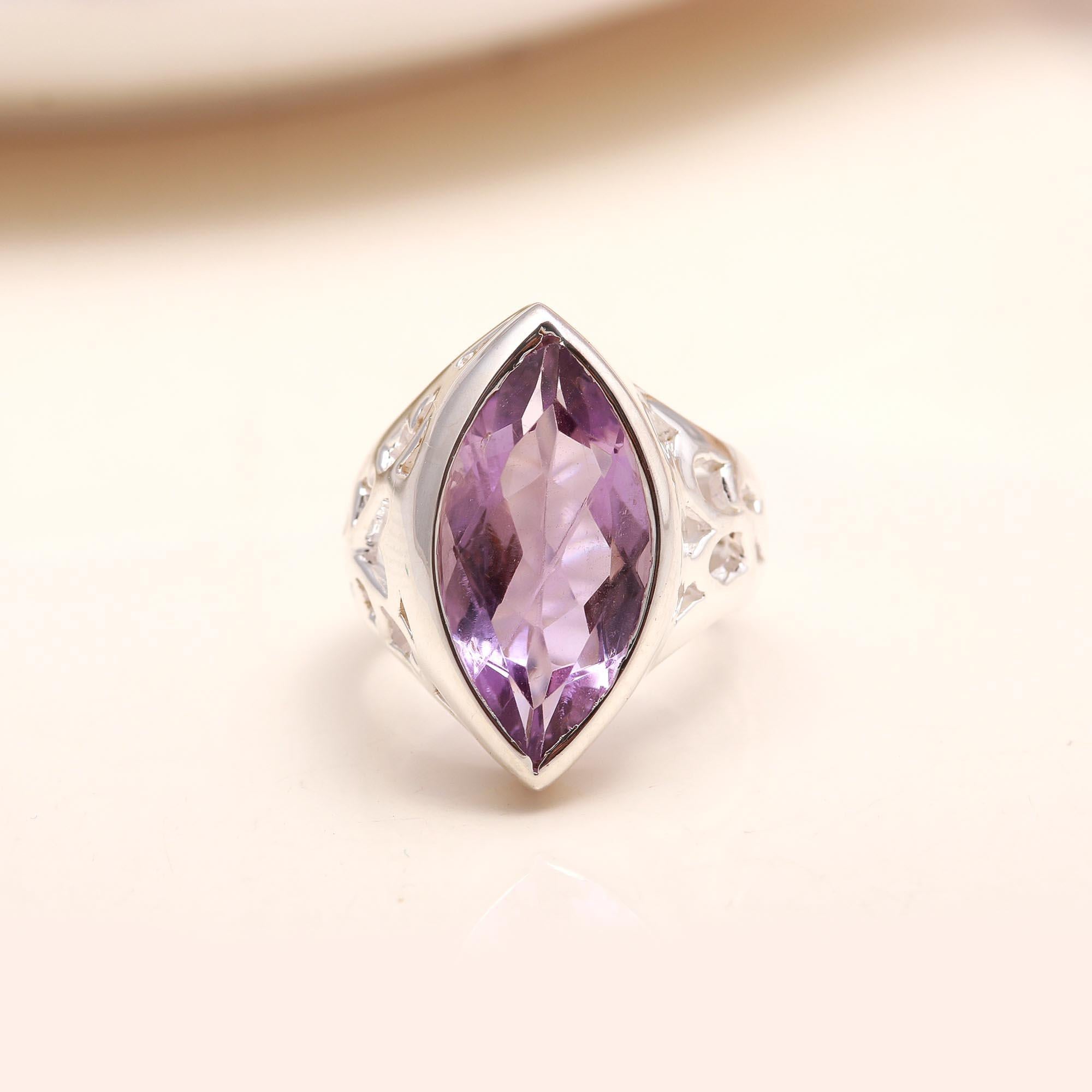 Close-up of marquise-cut amethyst on silver band