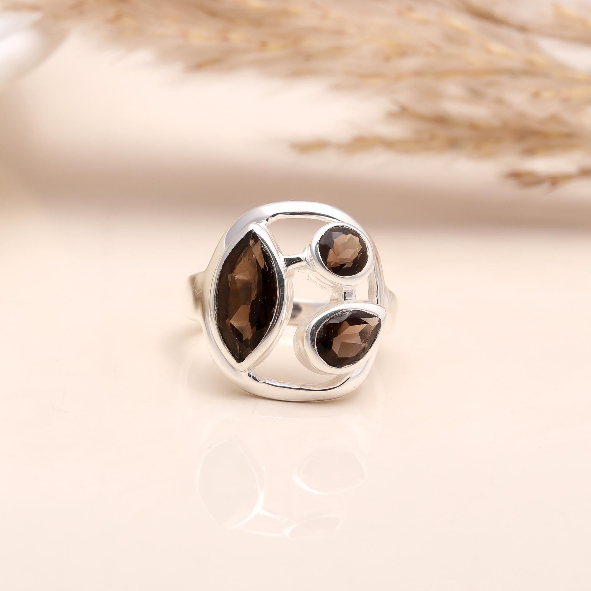 Sterling silver open-frame ring with multi-shape garnets
