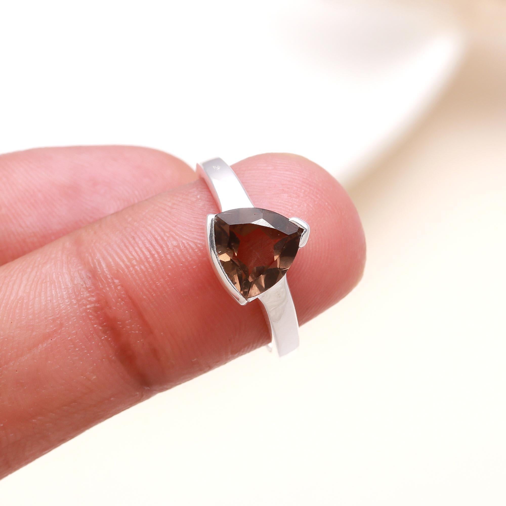 Smoky quartz solitaire gemstone ring on finger