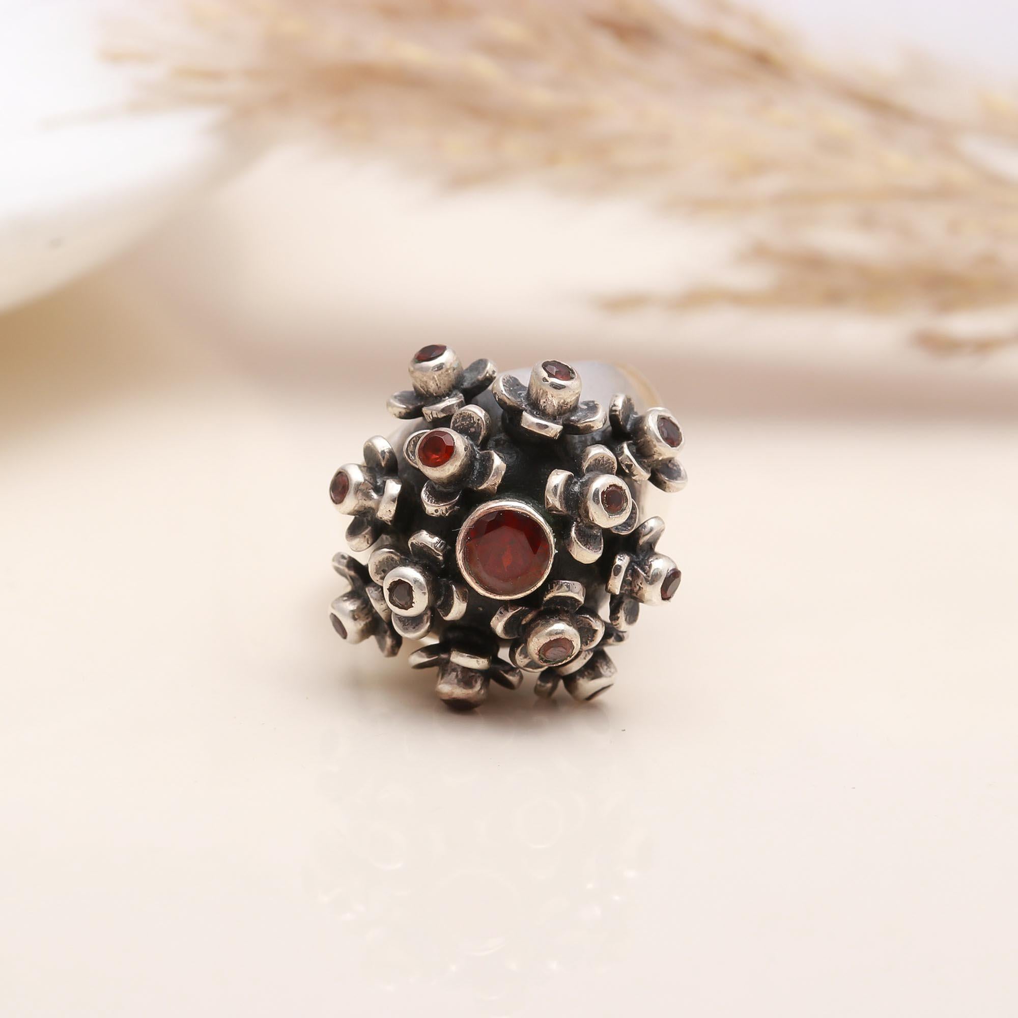 Dome-shaped garnet cluster ring in sterling silver