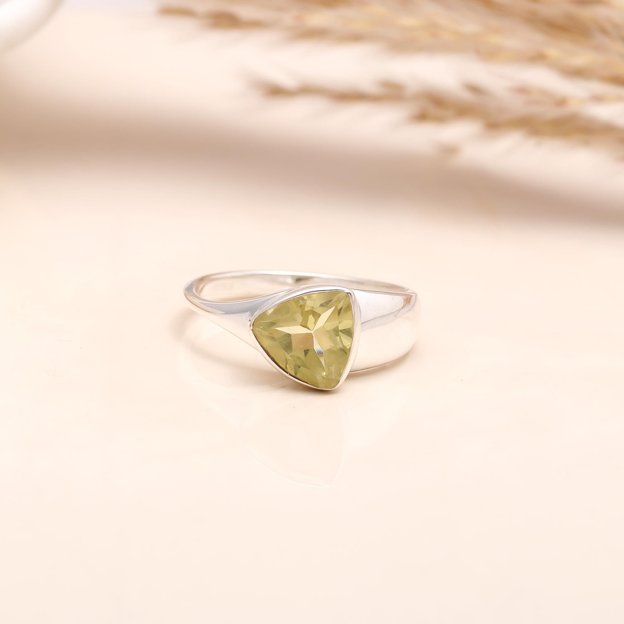 Close-up of trillion-cut lemon quartz silver ring