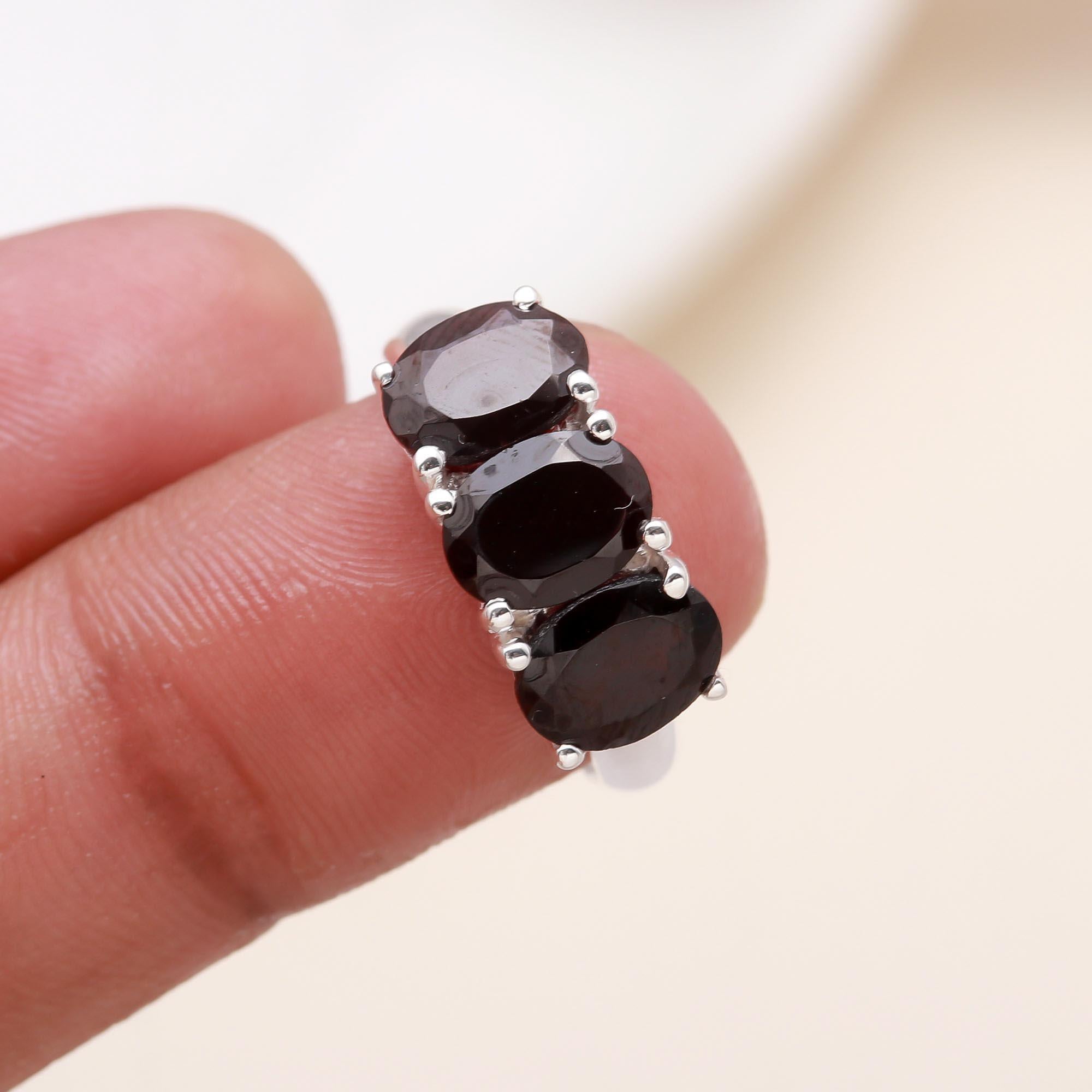 The Crimson Three: Oval Garnet Trio Ring